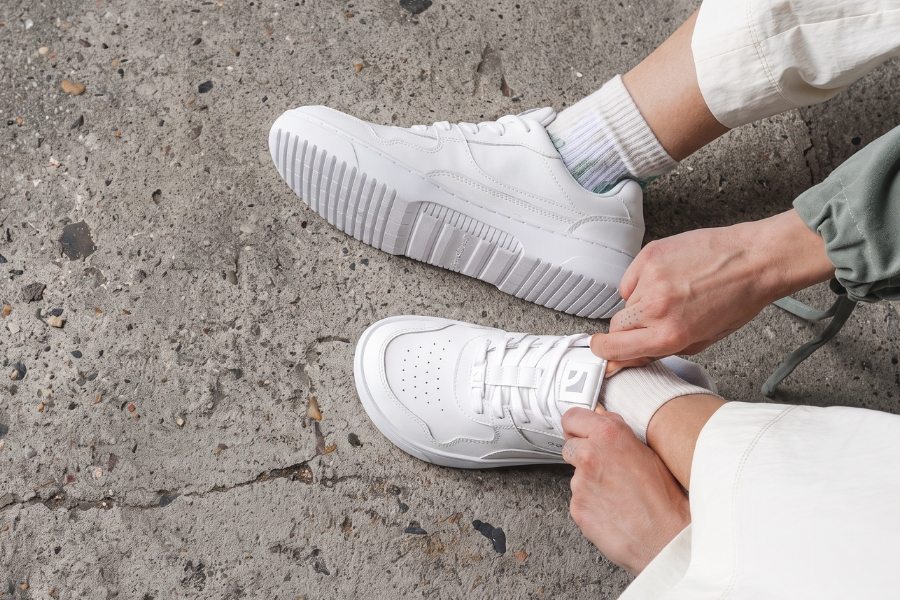 Lacing up white Barebarics barefoot sneakers Lacing up white Barebarics barefoot sneakers