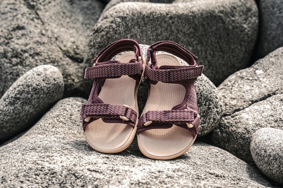 Adjustable women's barefoot sport sandals on rocks Adjustable women's barefoot sport sandals on rocks