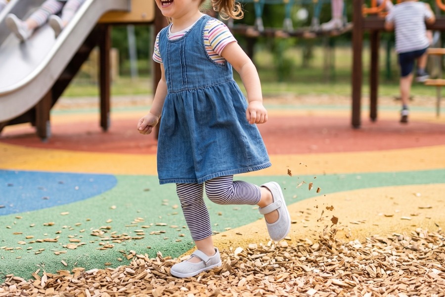 Kids' barefoot ballet flats on the playground Kids' barefoot ballet flats on the playground