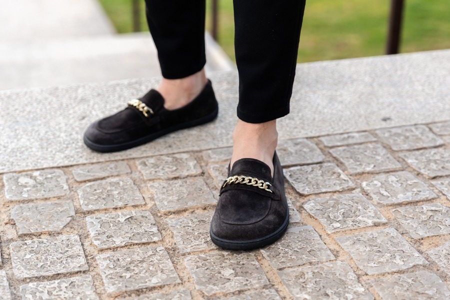 Close-up of men's barefoot loafers with a metal trim Close-up of men's barefoot loafers with a metal trim