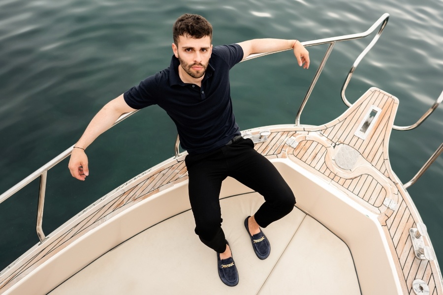 Navy men's barefoot loafers worn on a boat Navy men's barefoot loafers worn on a boat